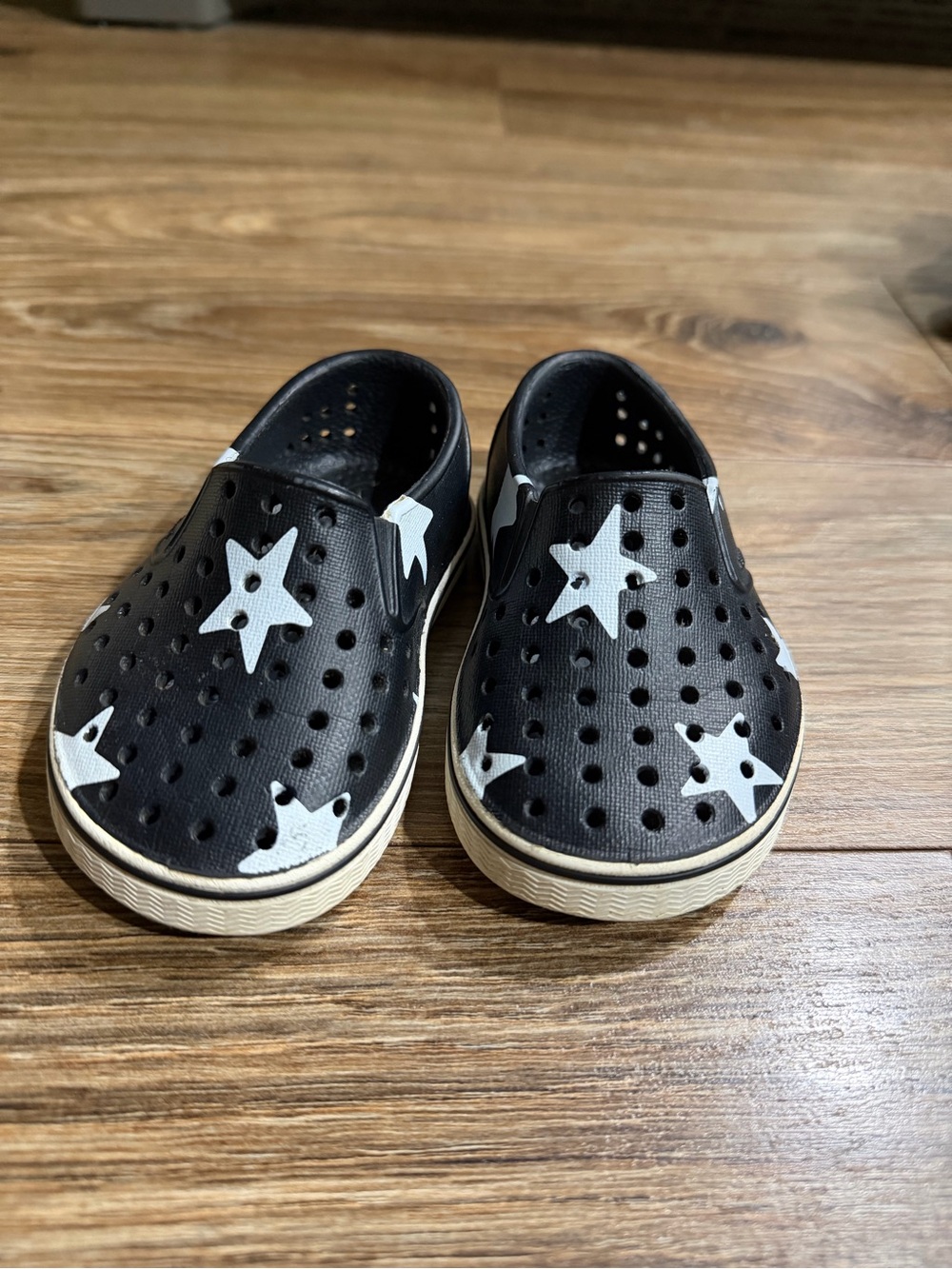 Native Shoes Black Slip-On Water Shoes with White Star Accents